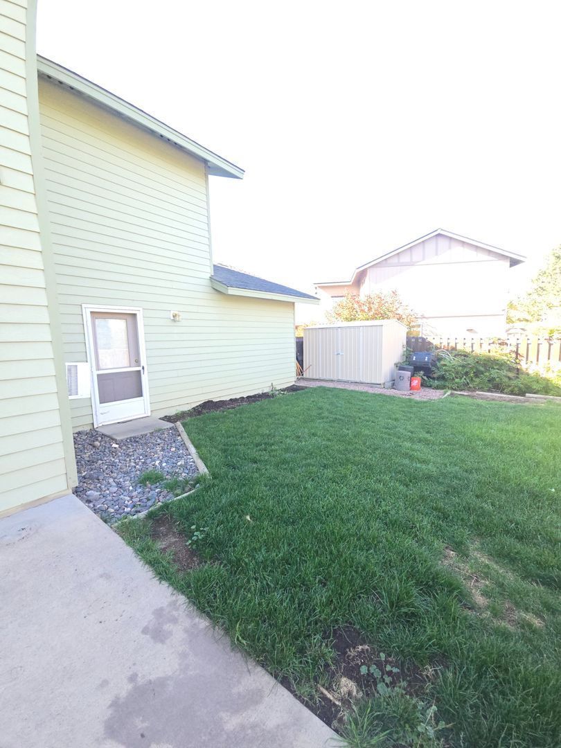 Charming Home with Gas Fireplace, Large Yard, Shed & Raised Garden Beds – Close to Parks property image