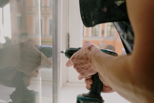 person using power drill